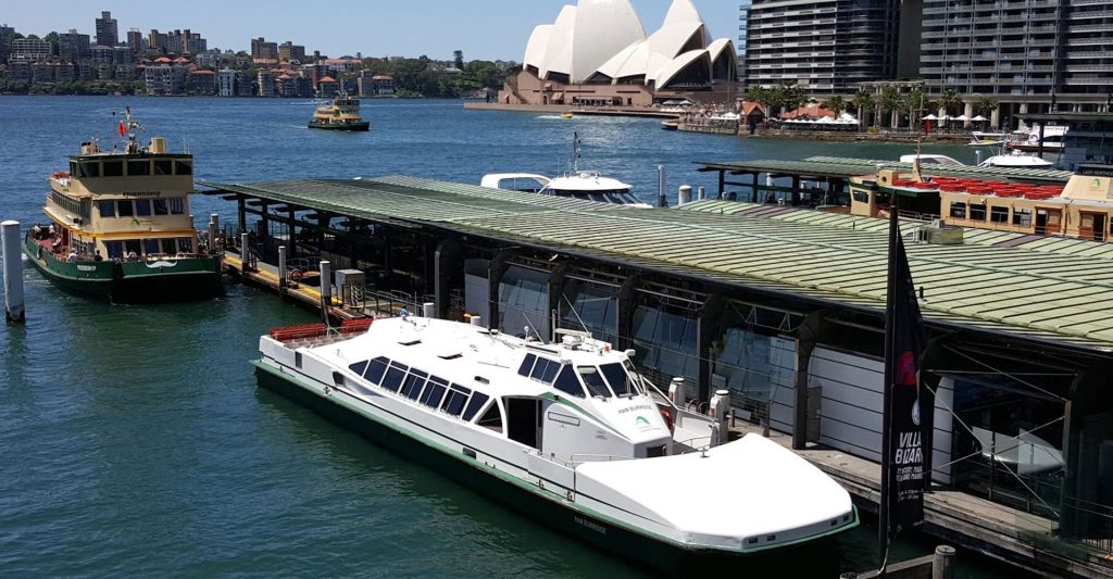 A Harbourcat vessel docked at a wharf in Circular Quay