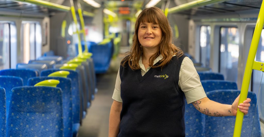 Image of Emma from Wellington Rail team on board a train