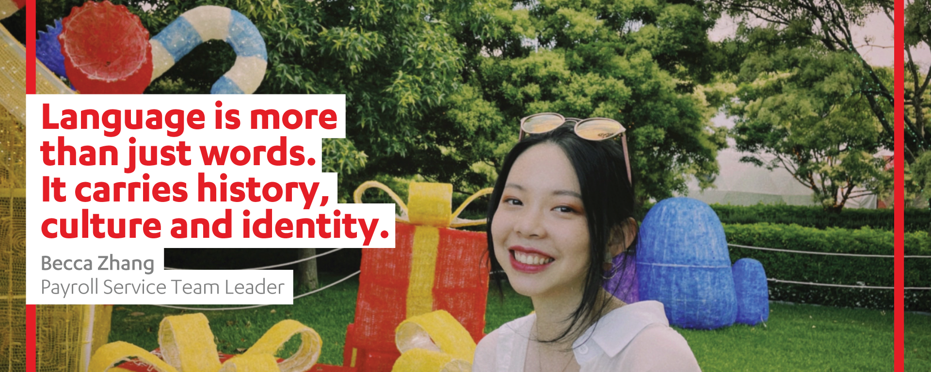 A young woman with glasses on her head is pictured in a park. A quote from her within the image reads "Language is more than just words. It carried history, culture and identity." The quote is credited to Becca Zhang and her title is Payroll Service Team Leader.